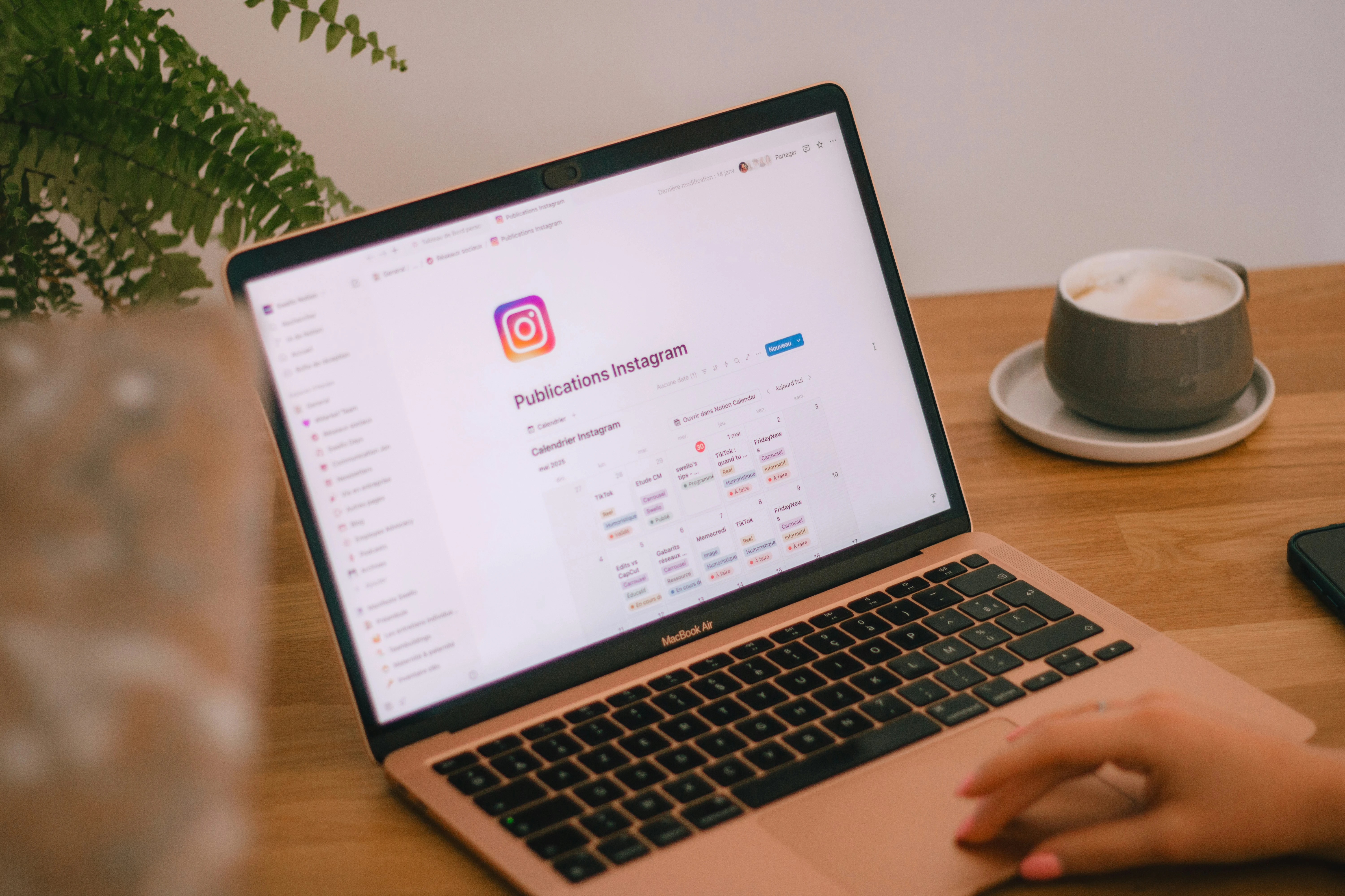 Person checking Instagram video download legality on a laptop
